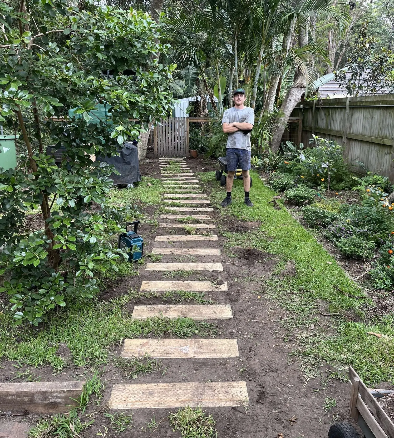 Tom from GridBuilt standing on a garden path